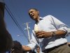 President Barack Obama holds a soft serve ice cream cone and shakes hands during his visit to DeWitt Dairy Treats, Tuesday, Aug. 16, 2011, in DeWitt, Iowa, during his three-day economic bus tour.  (AP Photo/Carolyn Kaster)