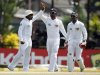Sri Lanka's captain Jayawardene celebrates with Paranavitana and Jayawardene after taking wicket of New Zealand's Flynn during fourth day of second and final test cricket match in Colombo