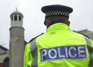 A man is in custody on suspicion of murder after an imam was killed at a London mosque