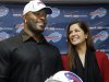 FILE - In this March 15, 2012 photo, Buffalo Bills' Mario Williams poses for a photo with his fiancee Erin Marzouki smile after an NFL football news conference in Orchard Park, N.Y. Here's one thing that can happen when love goes bad: Bills defensive end Mario Williams is suing his ex-fiancee, demanding she return a $785,000 diamond engagement ring. In response, Marzouki has filed a countersuit, calling Williams' demands "ridiculous." (AP Photo/David Duprey, File)