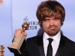 The winner for Best Performance by an Actor in a Supporting Role in a Series, Mini-Series or Motion Picture Made for Television Peter Dinklage poses with the trophy at the 69th annual Golden Globe ...