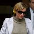 FILE -- Heather Mills clutches a cellphone as she leaves the High Court in London, in this Thursday March 1, 2007 file photo, following a preliminary hearing in her divorce case against Pail McCartney. Mills told the BBC in London, Wednesday Aug. 3, 2011, that a journalist from the Mirror group of newspapers boasted of having hacked into her phone.(AP Photo/Kirsty Wigglesworth, file)