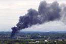 Smoke rises from the site of a train derailment near Maryville, Tennessee