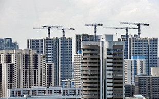 Our blogger advices Singaporeans to stay out of the property market for now. (AFP file photo)