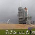 The space shuttle Atlantis sits on the launch pad as a rain cloud passes at the Kennedy Space Center Thursday, July 7, 2011, in Cape Canaveral, Fla. Atlantis is scheduled to launch on Friday, July 8 and is the 135th and final space shuttle launch for NASA. (AP Photo/Terry Renna)
