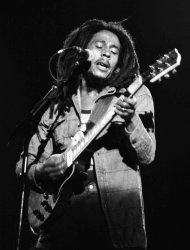 FILE - In this July 4, 1980 file photo, Jamaican Reggae singer Bob Marley performs at a reggae festival concert in Paris. "Marley," a documentary about Bob Marley, the charismatic icon of reggae music, directed by Kevin MacDonald, will be released worldwide on Friday, April 20, 2012, and was premiered in the singer's Caribbean homeland on Thursday. (AP Photo/file)