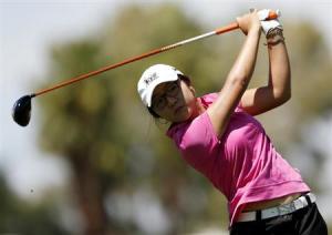 Fifteen-year old Lydia Ko of New Zealand tees off on the 12th hole during the third round of the Kraft Nabisco Championship LPGA golf tournament in Rancho Mirage