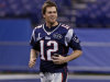 New England Patriots quarterback Tom Brady runs during Media Day for NFL football's Super Bowl XLVI Tuesday, Jan. 31, 2012, in Indianapolis. (AP Photo/Michael Conroy)