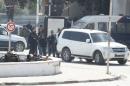 Police officers are seen outside parliament in Tunis