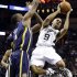 San Antonio Spurs' Tony Parker (9), of France, looks to pass as Indiana Pacers' Sam Young, left, defends during the third quarter of an NBA basketball game, Monday, Nov. 5, 2012, in San Antonio. (AP Photo/Eric Gay)
