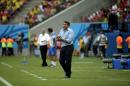Honduras' head coach Luis Suarez instructs his players from the sideline during the group E World Cup soccer match between Honduras and Switzerland at the Arena da Amazonia in Manaus, Brazil, Wednesday, June 25, 2014. (AP Photo/Felipe Dana)