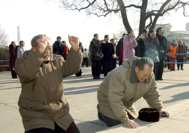 North Korean men cry as they …