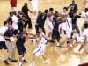 DELETES NAME FROM BYLINE IN HEADER FIELD - Players of the Georgetown University men's basketball team and China's Bayi Rockets fight during their exhibition game in Beijing, China, Thursday, Aug. 18, 2011. The bench-clearing brawl at the exhibition game between American and Chinese basketball teams marred the orchestrated harmony of U.S. Vice President Joe Biden's visit to China. The fight forced the game to end early. (AP Photo/CD-ANPF)