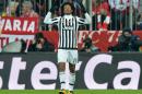 Juventus' Juan Cuadrado celebrates his side's second goal during the Champions League round of 16 second leg soccer match between FC Bayern Munich and Juventus Turin in Munich, southern Germany, Wednesday, March 16, 2016. (AP Photo/Kerstin Joensson)