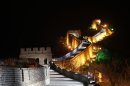 The Great Wall of China is lit up shortly before the lights go off to mark 'Earth Hour' as part of a global effort to shine a spotlight on climate change in north of Beijing, China, Saturday, March 31, 2012. (AP Photo/ Vincent Thian)
