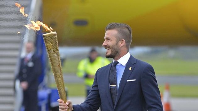 David Beckham carries the Olympic torch