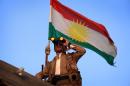 A Kurdish Peshmerga fighter holds a position on the front line in the Gwer district, 40 kilometres south of Arbil, the capital of the Kurdish autonomous region in northern Iraq, on September 18, 2014