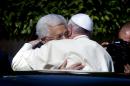Palestinian President Mahmoud Abbas, left, and Pope Francis hug each other as Francis arrives at the Palestinian Authority headquarters in the West Bank city of Bethlehem on Sunday, May 25, 2014. Francis landed Sunday in the West Bank town of Bethlehem in a symbolic nod to Palestinian aspirations for their own state as he began a busy second day of his Mideast pilgrimage. (AP Photo/Nasser Nasser)