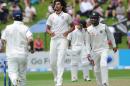 India's Ishant Sharma, centre, takes his third wicket, that of New Zealand's Tom Latham for 0 on the 1st day of the 2nd cricket test, Basin Reserve, Wellington, New Zealand, Friday, February 14, 2014. (AP Photo/SNPA, Ross Setford) NEW ZEALAND OUT