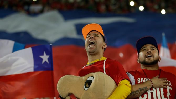 Fans of Chile sing the national anthem prior a Copa America semifinal soccer match against Peru at the National Stadium in, Santiago, Chile, Monday, June 29, 2015. (AP Photo / Luis Hidalgo)