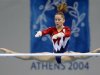 Carly Patterson of the U.S. performs a routine on the asymmetric bars during the women's artistic gy..