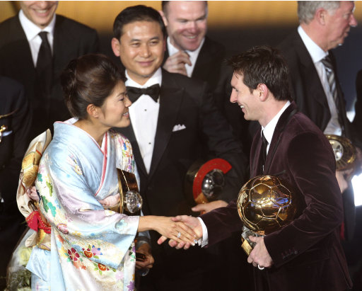Argentina's Lionel Messi and Japan's Homare Sawa shake hands after being awarded the prize for the soccer players of the year 2011 at the FIFA Ballon d'Or awarding ceremony in Zurich, Switzerland, Monday, Jan. 9, 2012. (AP Photo/Michael Probst)