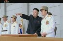 Still image taken from video footage of North Korean leader Kim Jong-un pointing during a military ceremony