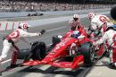 Scott Dixon, of New Zealand, makes a pit stop during the 99th running of the Indianapolis 500 auto race at Indianapolis Motor Speedway in Indianapolis, Sunday, May 24, 2015. (AP Photo/Sam Riche)