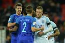 England's striker Jamie Vardy (R) shakes hands with Netherlands' defender Joel Veltman (2R) after the final whistle during an international friendly football match at Wembley Stadium in London on March 29, 2016