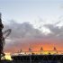 The sun sets behind the Olympic Stadium and Orbit tower at the Olympic Park in Stratford in east London