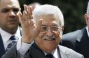 FILE - In this Sept. 7, 2014, file photo, Palestinian President Mahmoud Abbas waves to photographers as he arrives to attend an Arab foreign minister meeting at the Arab League headquarters in Cairo, Egypt. It's a busy week in Mideast diplomacy, book-ended by the launch of Israel-Hamas talks about a border deal for blockaded Gaza and the Palestinian president's U.N. speech scheduled for Friday, Sept, 26, 2014, about a new strategy for dealing with Israel. (AP Photo/Hassan Ammar, File)