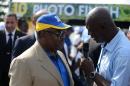 President of Gabon Ali Bongo Ondimba (L) answers a journalist's questions on the last day of the 10th Tropicale Amissa Bongo cycling tour of Gabon in Libreville on February 22, 2015
