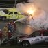 Emergency workers put out a fire on a jet dryer during the NASCAR Daytona 500 auto race at Daytona International Speedway in Daytona Beach, Fla., Monday, Feb. 27, 2012. (AP Photo/Bill Friel)