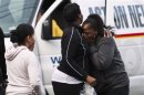 People react during a hostage situation in Trenton, New Jersey