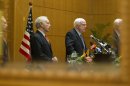 Visiting U.S. Senators, John McCain, R-Ariz., right, and Joe Lieberman, I-Conn., are reflected in a mirror during a press conference in Kuala Lumpur, Malaysia, Thursday, May 31, 2012. (AP Photo/Mark Baker)