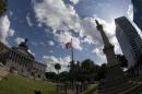 The confederate battle flag flies at the South Carolina State House grounds in Columbia