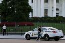 A United States uniformed Secret Service officer is seen at a post in front of the White House in Washington