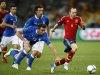 Spain's Iniesta challenges Italy's Barzagli during their Euro 2012 final soccer match at the Olympic stadium in Kiev