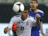 Germany's Mueller is challenged by Tibi of Israel during their friendly soccer match in Leipzig