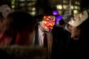 Anonymous supporters wearing Guy Fawkes masks gather in Trafalgar Square before the start of a protest march towards Britain's Houses of Parliament in London, Monday, Nov. 5, 2012. The protest was held on November 5, to coincide with the failed 1605 gunpowder plot to blow up the House of Lords. (AP Photo/Matt Dunham)