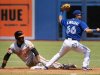 Baltimore Orioles Chris Dickerson is safe at second after Toronto Blue Jays Munenori Kawasaki applied the tag during the first inning of their MLB American League baseball game in Toronto