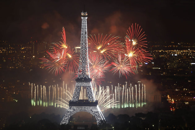 Fireworks illuminate the Eiffel Tower in Paris during Bastille Day celebrations late Thursday, July 14, 2011. (AP Photo/Thibault Camus)