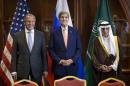 Russia's Foreign Minister Sergey Lavrov, U.S. Secretary of State John Kerry and Saudi Arabia's Foreign Minister Adel al-Jubeir stand together before a trilateral meeting in Doha, Qatar