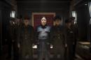In this undated photo provided by Columbia Pictures - Sony, Actor Randall Park, center, portrays North Korean leader Kim Jong Un in Columbia Pictures' "The Interview." If the U.S. government's claim that North Korea was involved in the unprecedented hack attack on Sony Pictures that scuttled Seth Rogen's latest comedy is correct, no one can say they weren't warned. The movie, 