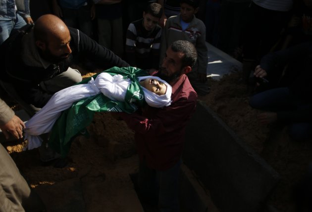 man buries a Palestinian child …