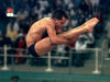 FILE - In this July 28, 1996 file photo, defending gold medalist Mark Lenzi of the United States competes in the preliminaries of the Olympic men's 3-meter springboard competition at Georgia Tech in Atlanta. Lenzi, the last American male diver to win Olympic gold, died Monday, April 9, 2012 at the age of 43 in Greenville, N.C. (AP Photo/Luca Bruno, File)