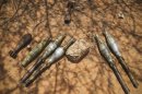 Unexploded ordinance left behind by Al Shabaab lay on the ground ahead of being destroyed by controlled detonation carried out by a combat engineering team serving with the Kenyan Contingent of the AMISOM in the southern Somali port city of Kismayo