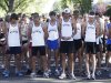 Members of the University of Wyoming cross country team gather their thoughts during a moment of silence on Saturday,  Sept. 10, 2011  at the annual Always A Cowboy 8K run and 5K walk In Laramie, Wyo.  (AP Photo/Laramie Boomerang, Andy Carpenean)