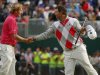 Brandt Snedeker of the U.S. shakes hands with Adam Scott of Australia as they finish their third round of the British Open golf championship at Royal Lytham & St Annes