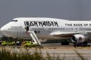 The Iron Maiden plane, nicknamed "Ed Force One", came untethered while being towed for refueling and injured two ground crew in the process